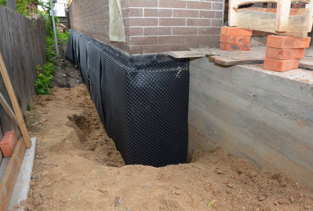 SJ Waterproofing Pros technician performing targeted Waterproofing assessment in Coral, MI